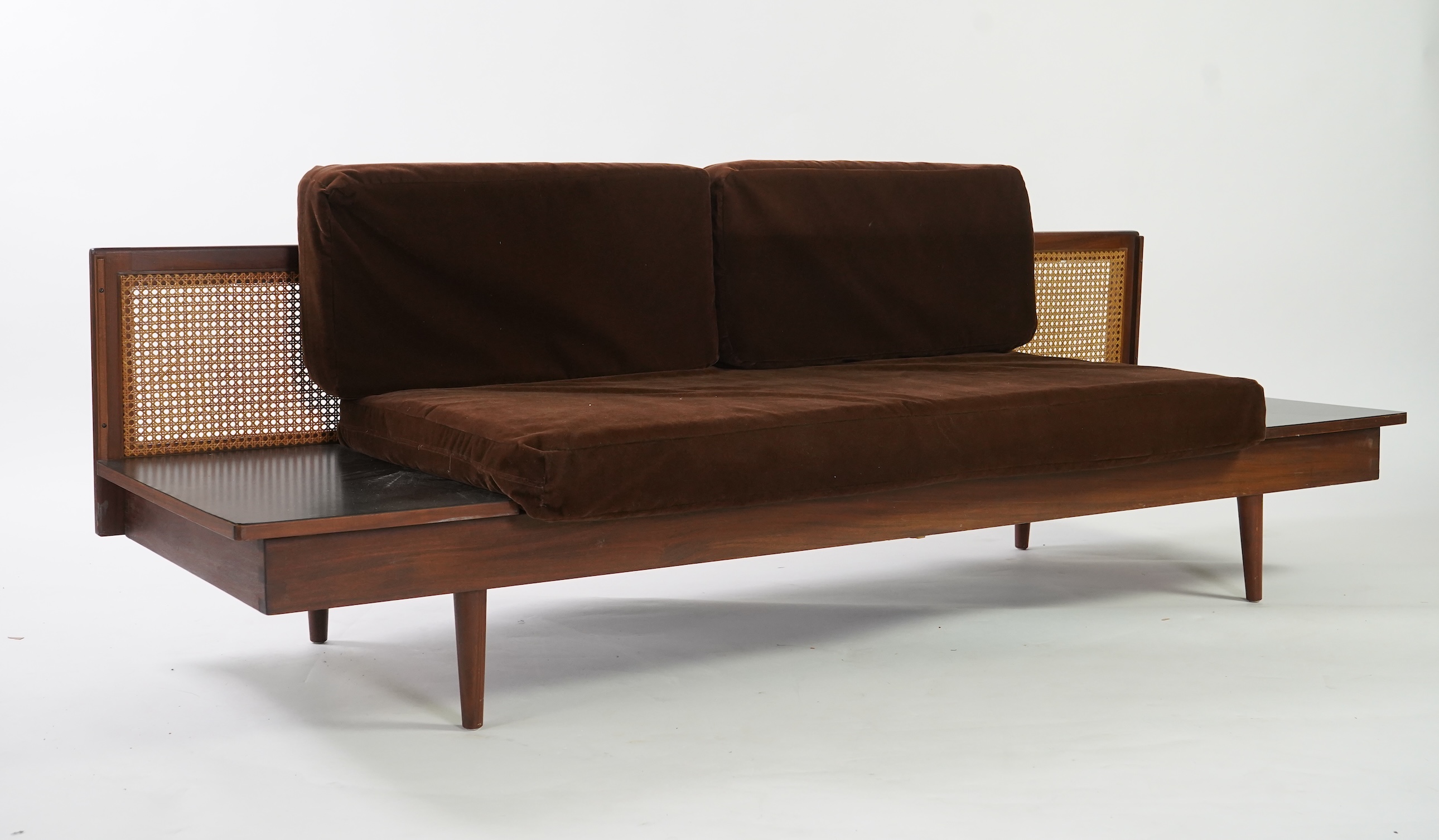 Dennis Young (British): A caned teak sofa/daybed